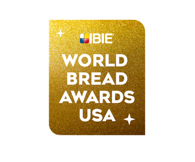 Gold card with 'WORLD BREAD AWARDS USA' text and IBIE logo on a white background